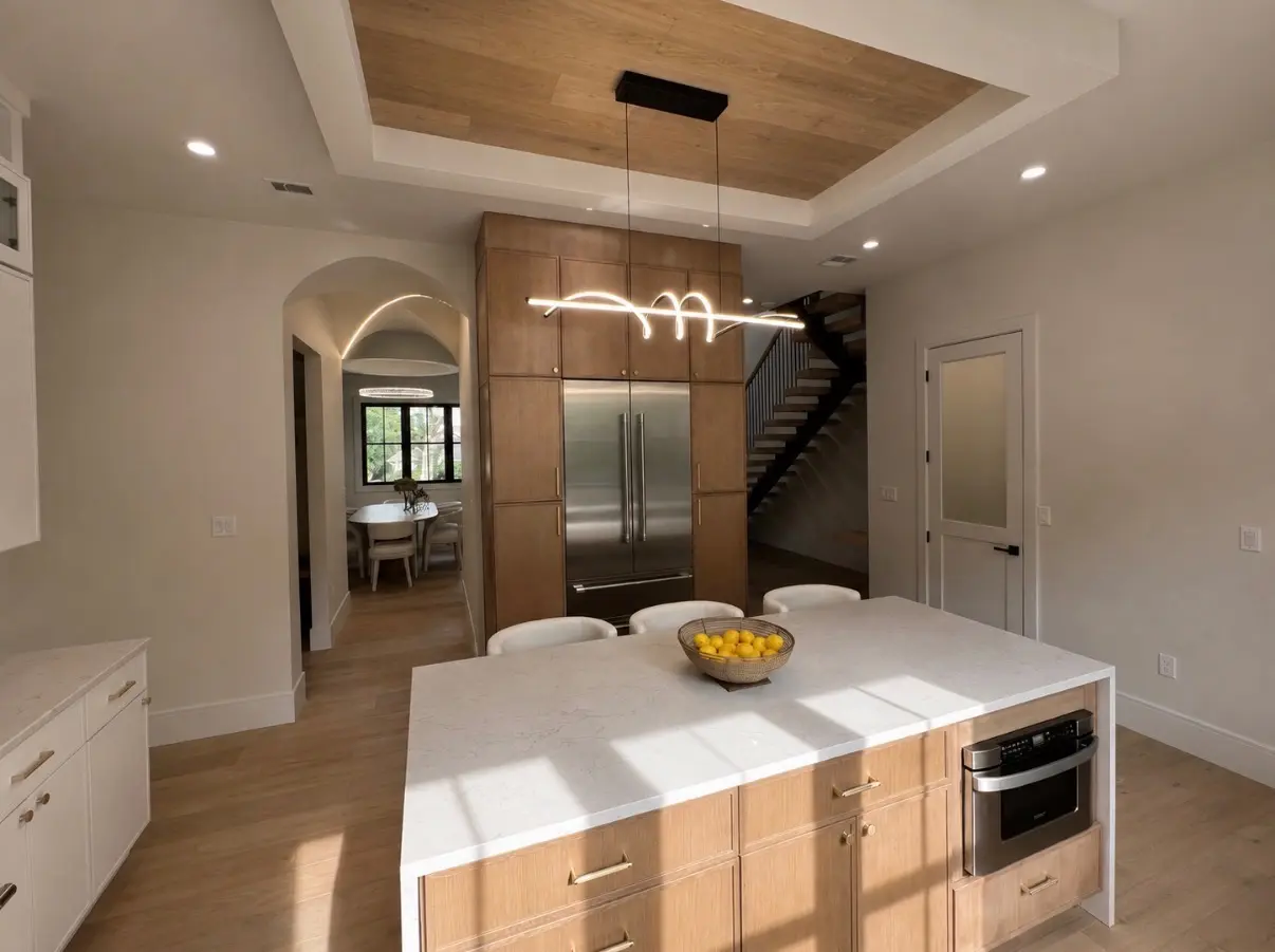 Open-concept new construction kitchen with island seating by ARS Home Improvement
